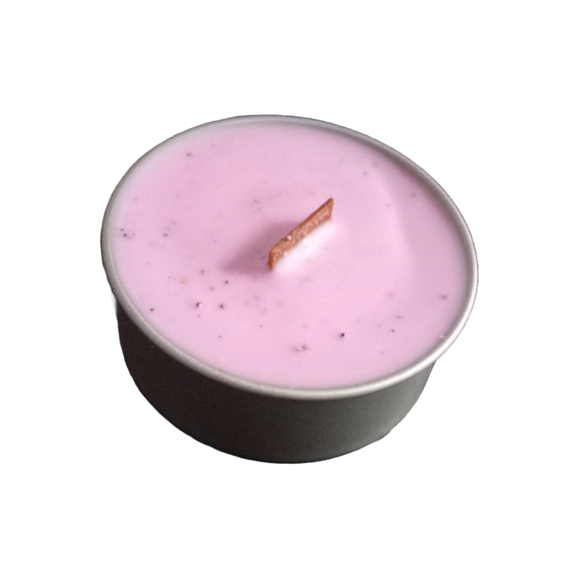 Coconut soy wax candles in metal containers, presented in a variety of colors, including pink, red, yellow, and white, purple.