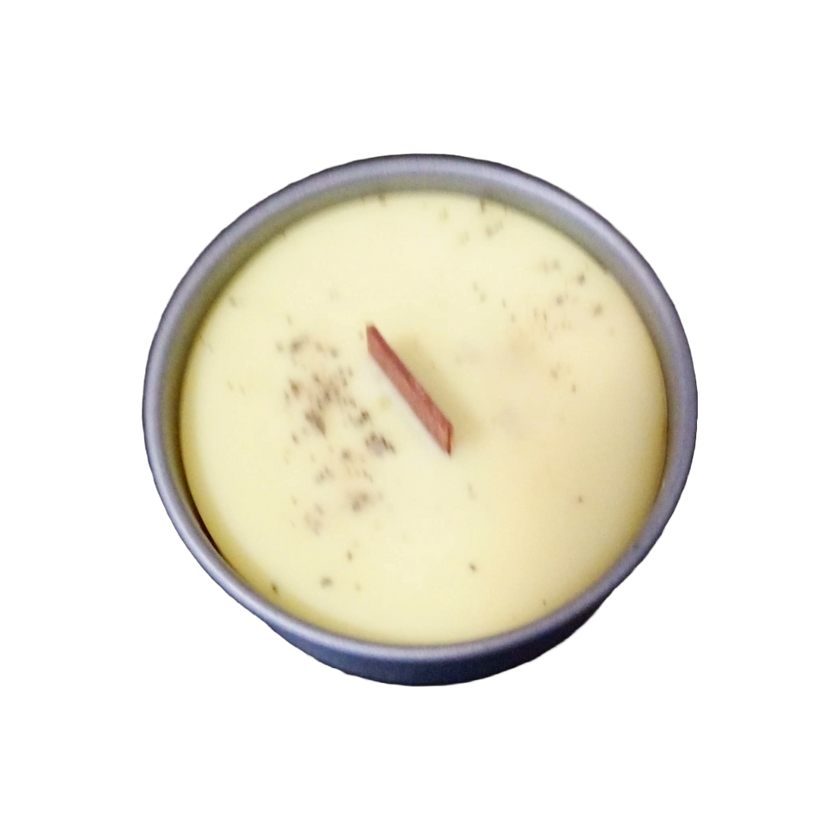 Coconut soy wax candles in metal containers, presented in a variety of colors, including pink, red, yellow, and white, purple.